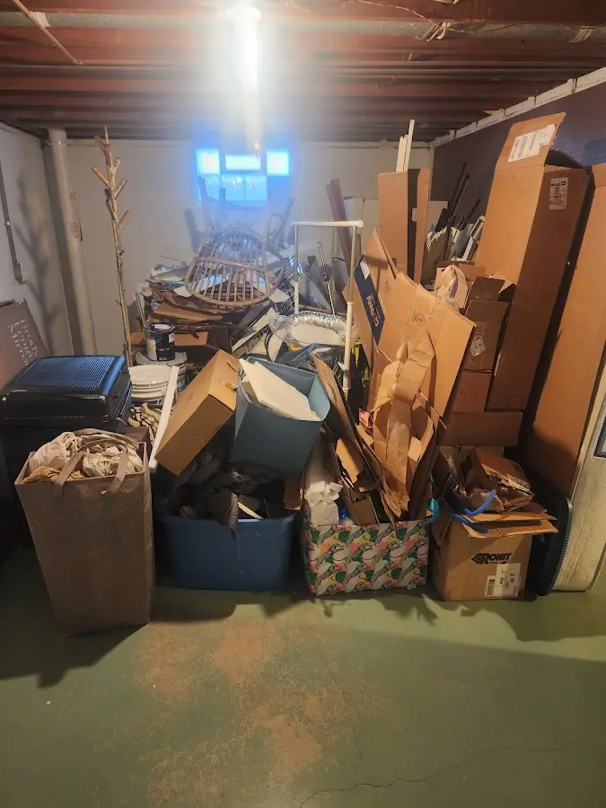 Roll-off dumpster container at job site for 2 Yard Dumpster Rental in Tittabawassee